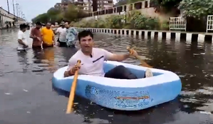 BJP Councillor Takes 'boat Ride' in Waterlogged Patparganj, Slams AAP Govt