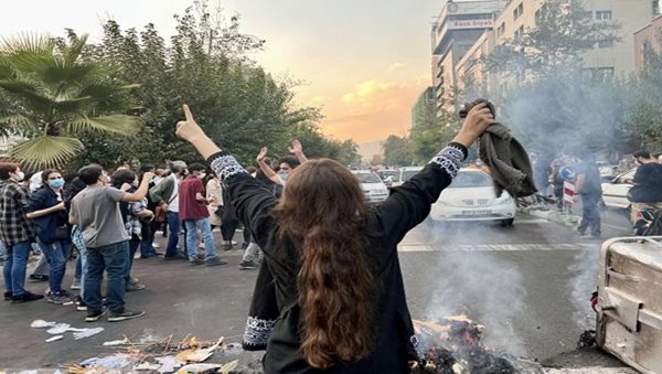 Women burn headscarves as anti-hijab protests continue in Iran