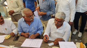 After Casting Vote, Union Minister Shekhawat Makes Voters' Slips outside Polling Booth