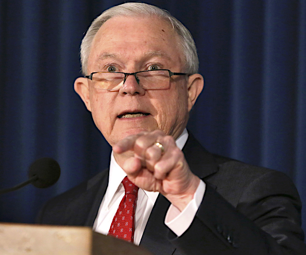 jeff sessions gestures during a news conference