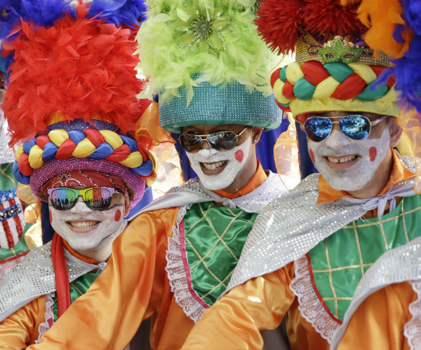 Dancers at the Calle Ocho festival pose for photos before performing om 2015.