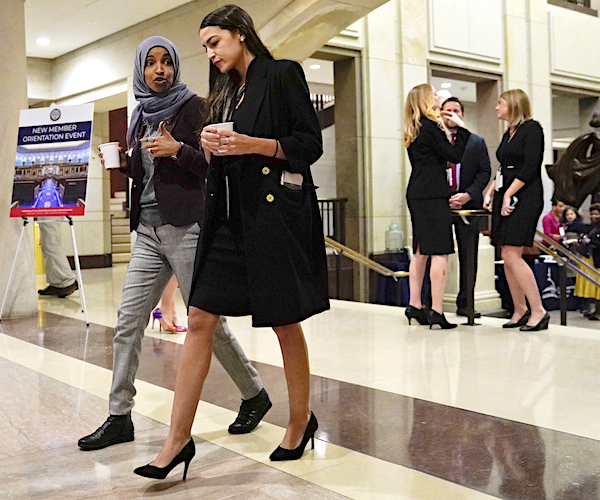 ilhan omar and alexandria ocasio-cortez walk and talk through the halls of capitol hill