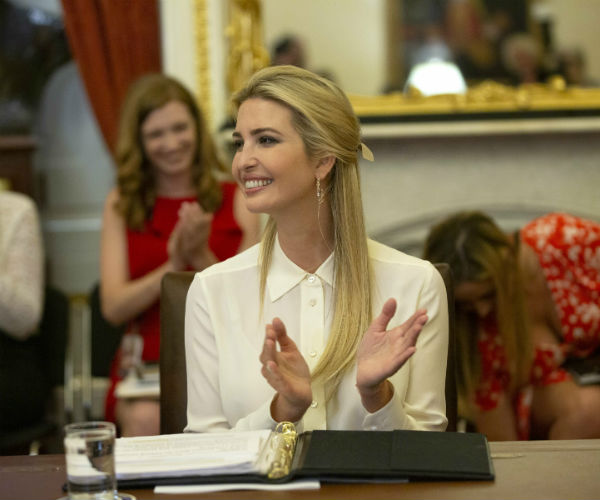 ivanka trump claps her hands at a rountable on women, peace and security.