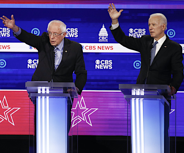 bernie sanders and joe biden compete to get time in during a democratic presidential primary debate