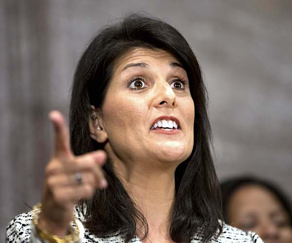 nikki haley points during a news conference