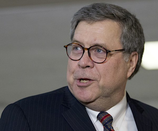 william barr looks back over his right shoulder