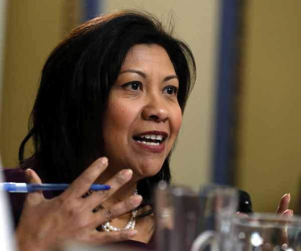 rep. norma torres gestures with her hands as she speaks on capitol hill